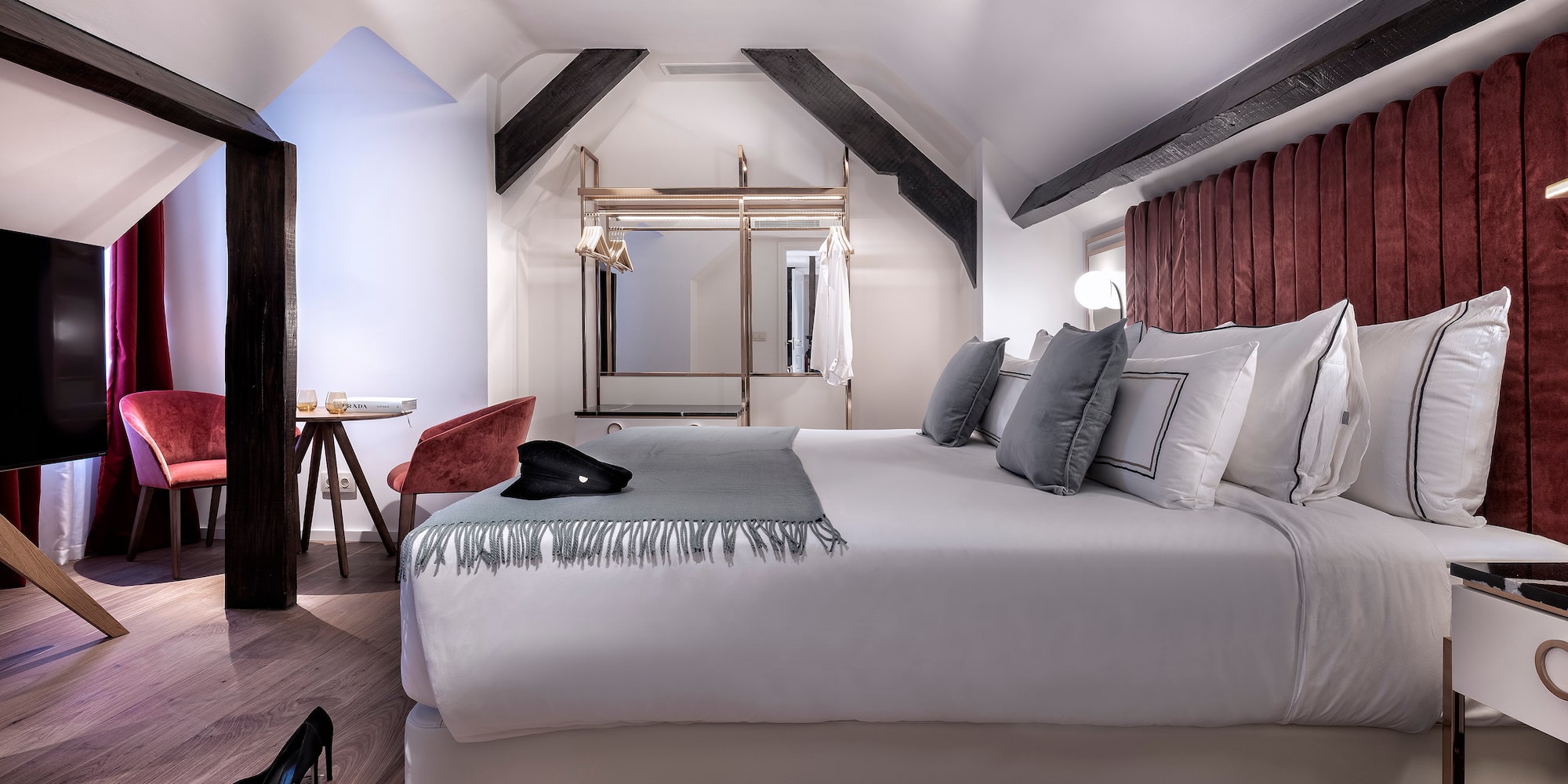 a room with a bed and a mirror