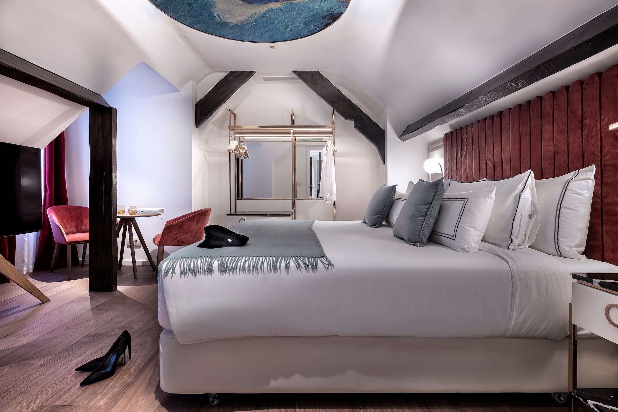 a room with a bed and a mirror