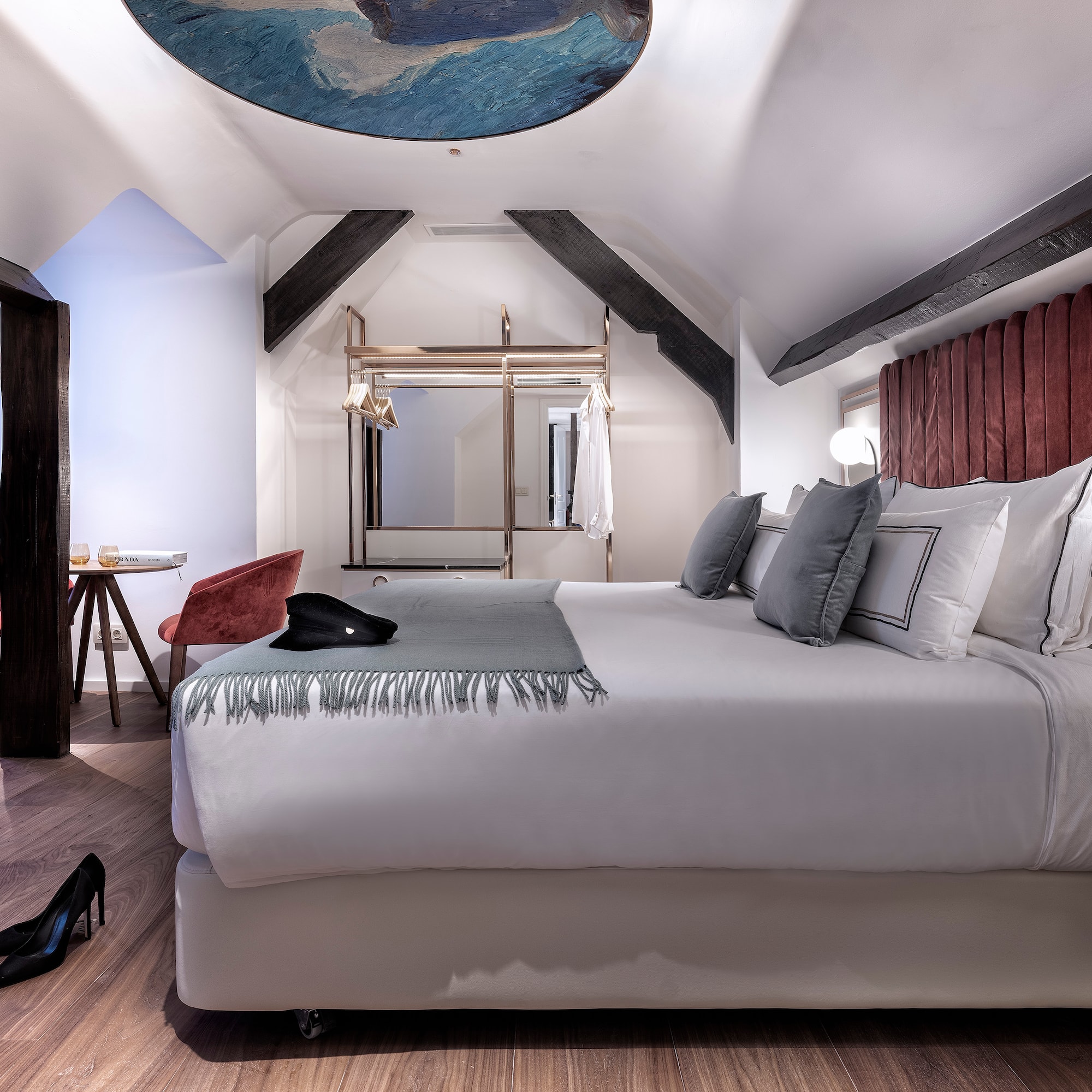 a room with a bed and a mirror