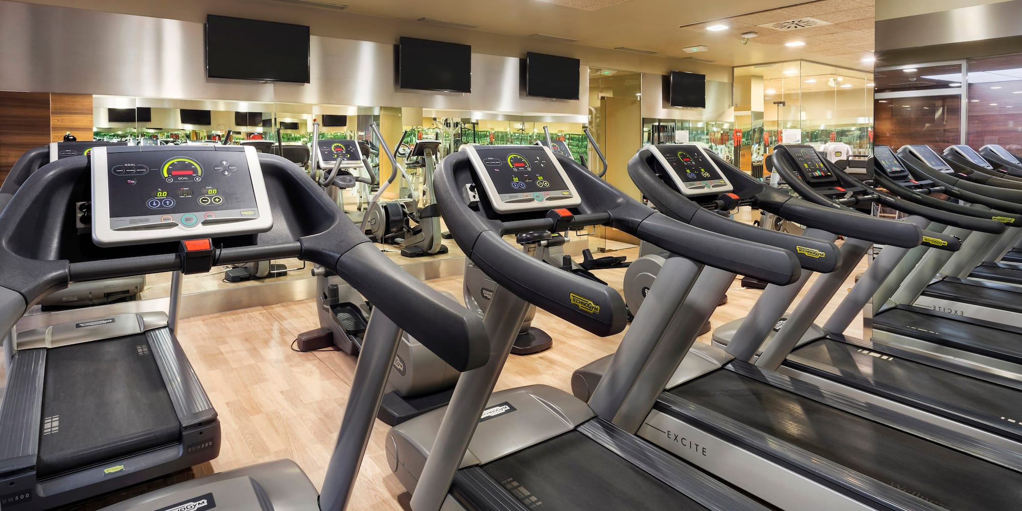 a group of treadmills in a gym