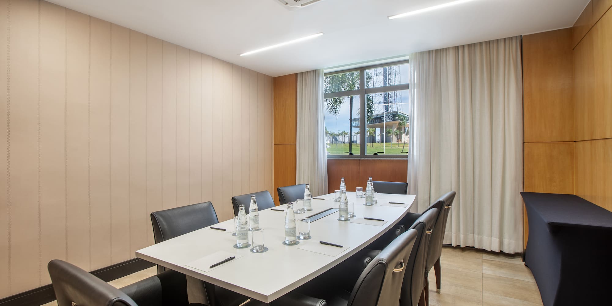 a conference room with a table and chairs