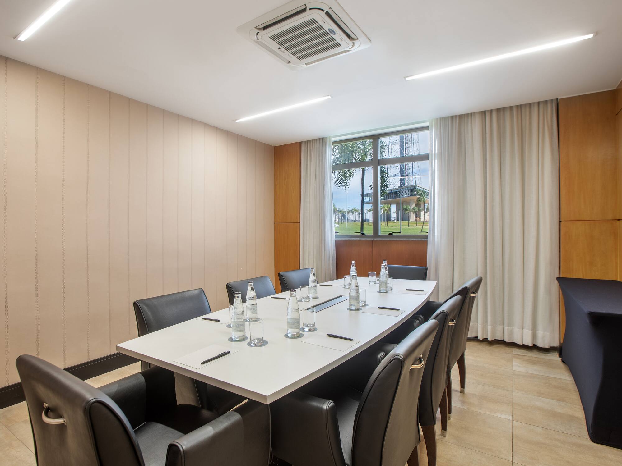 a conference room with a table and chairs