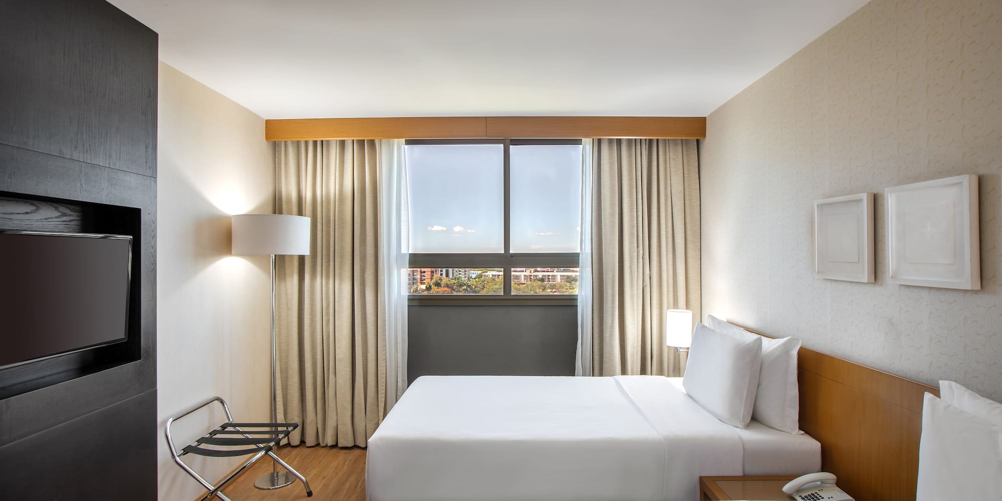 a room with two beds and a chair