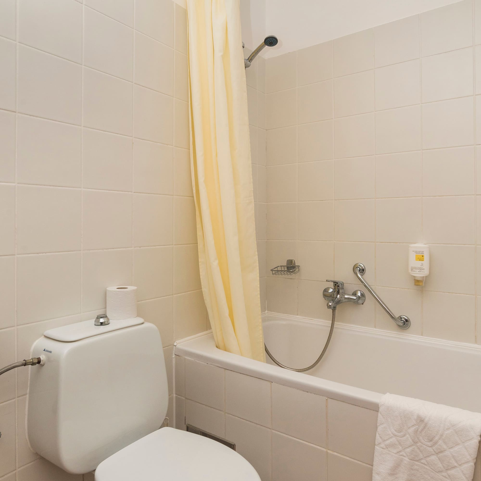 a bathroom with a toilet and bathtub