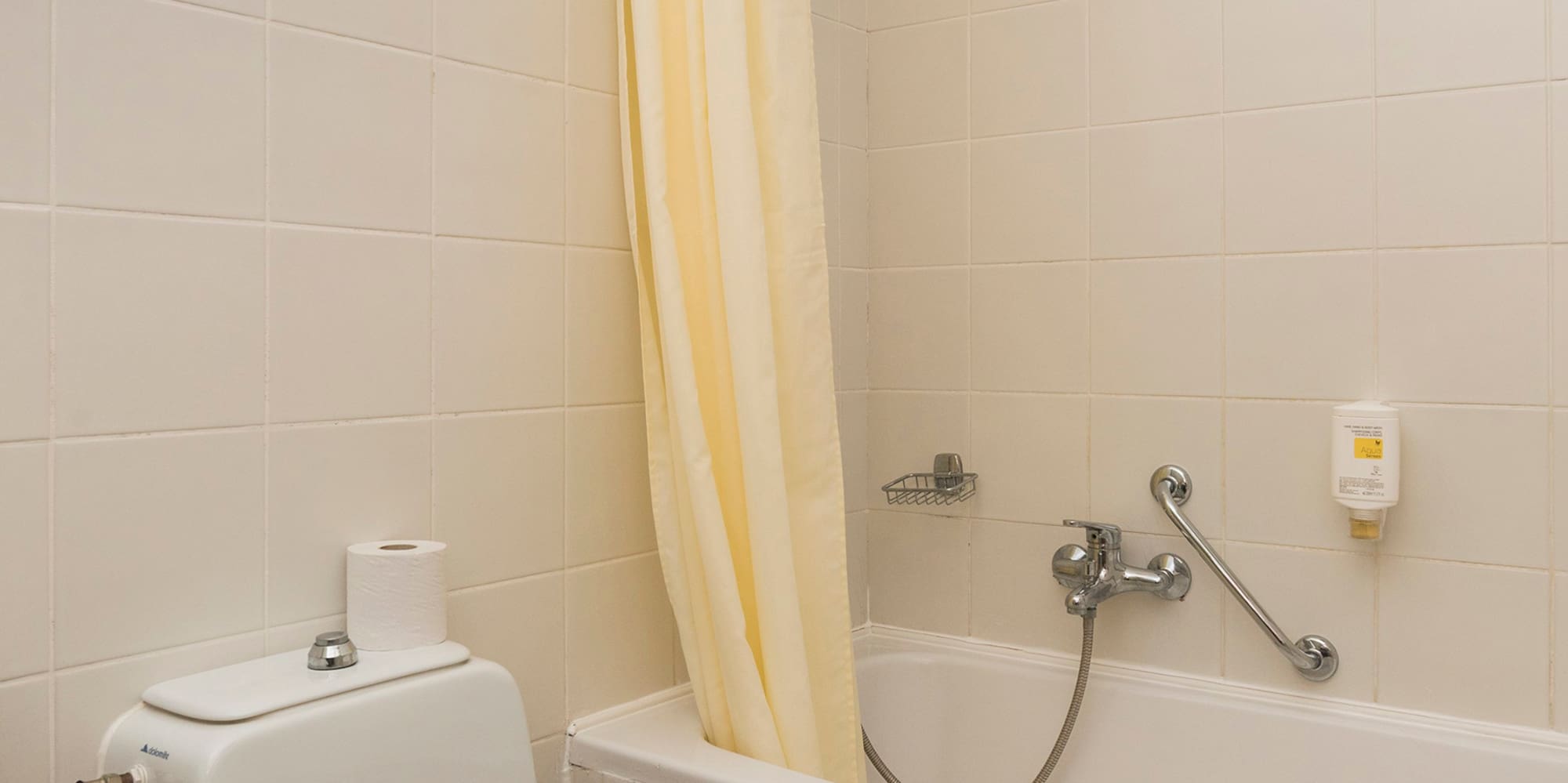 a bathroom with a toilet and bathtub
