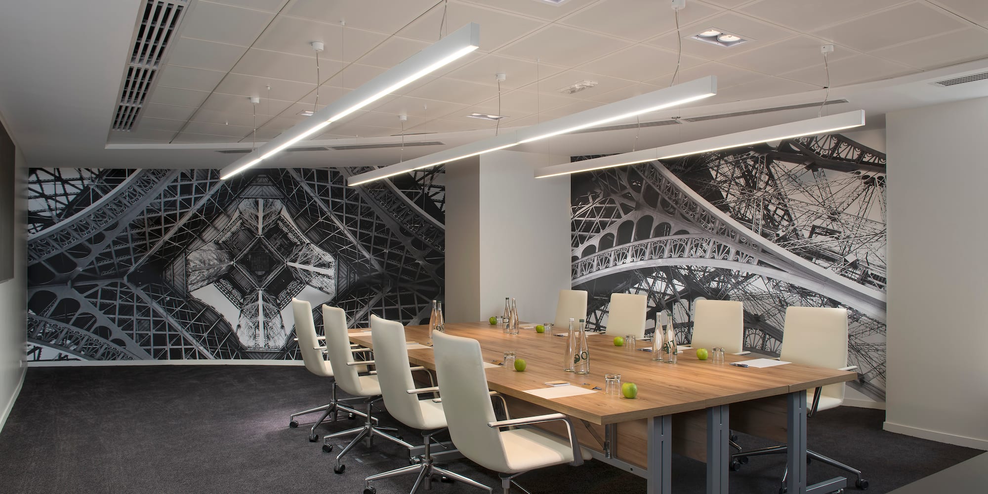 a conference room with a table and chairs 