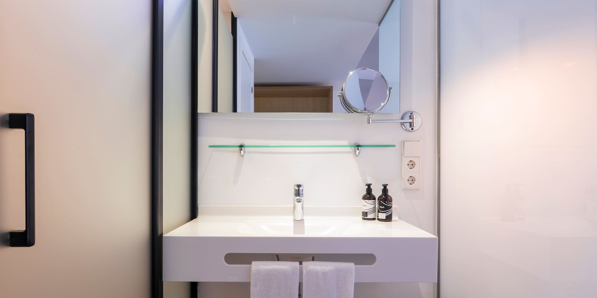 a bathroom with a mirror and a sink