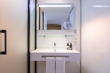 a bathroom with a mirror and a sink