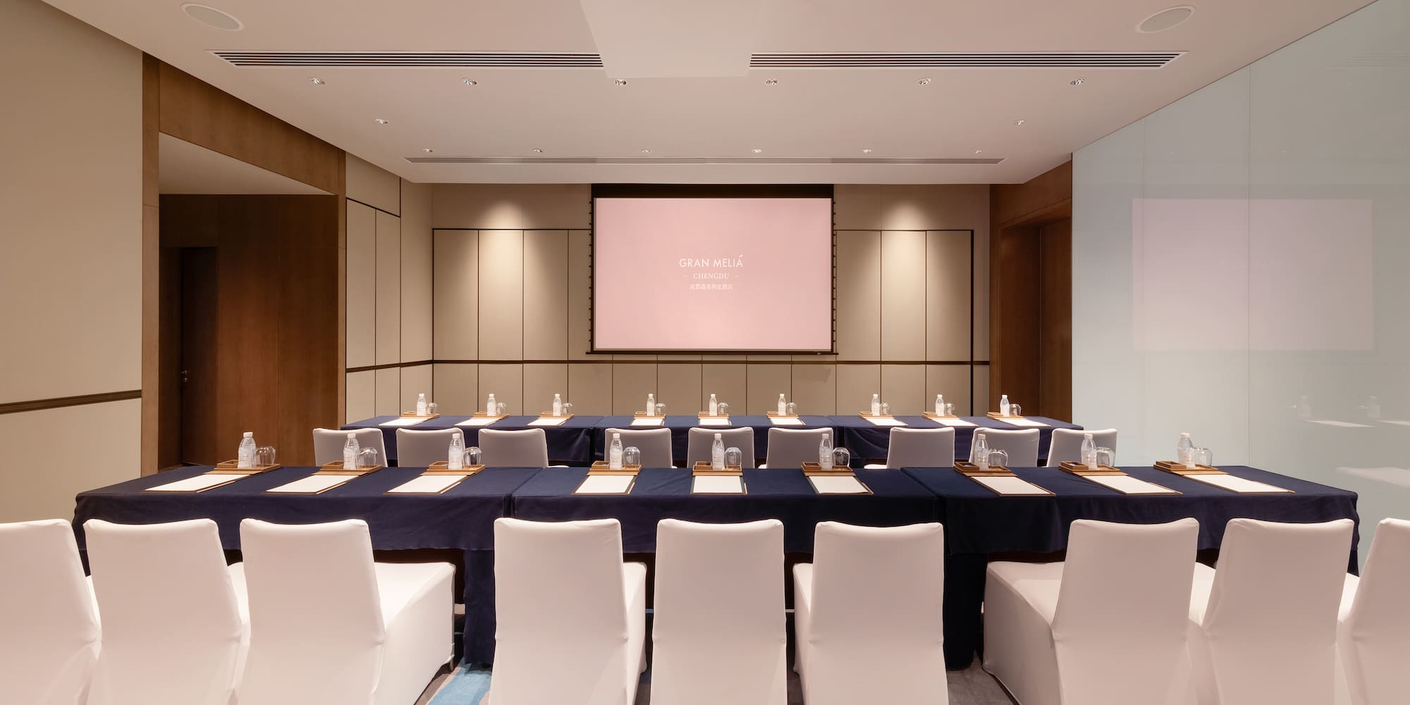 a room with a large table and chairs