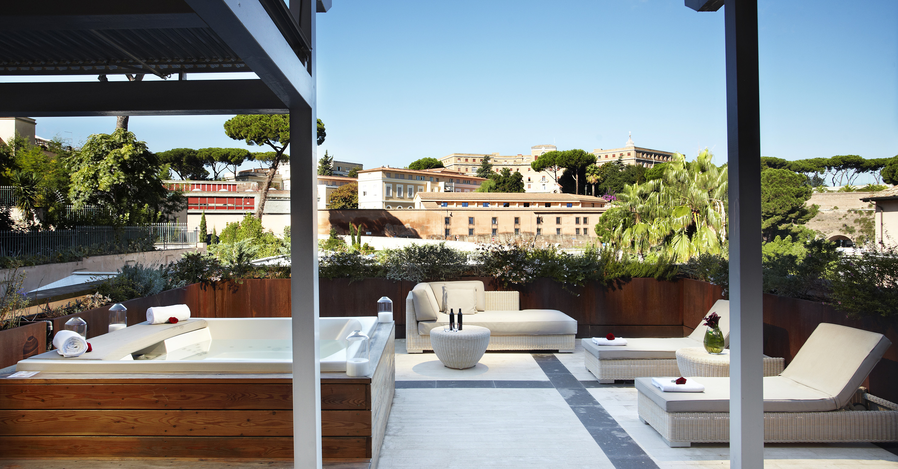 a patio with a hot tub and a jacuzzi
