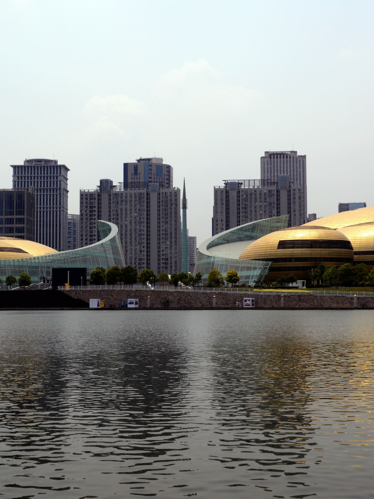 a large building next to a body of water