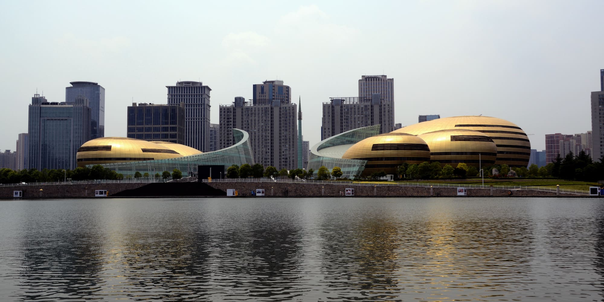 a large building next to a body of water