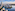 a city with buildings around a body of water