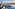 a city with buildings around a body of water