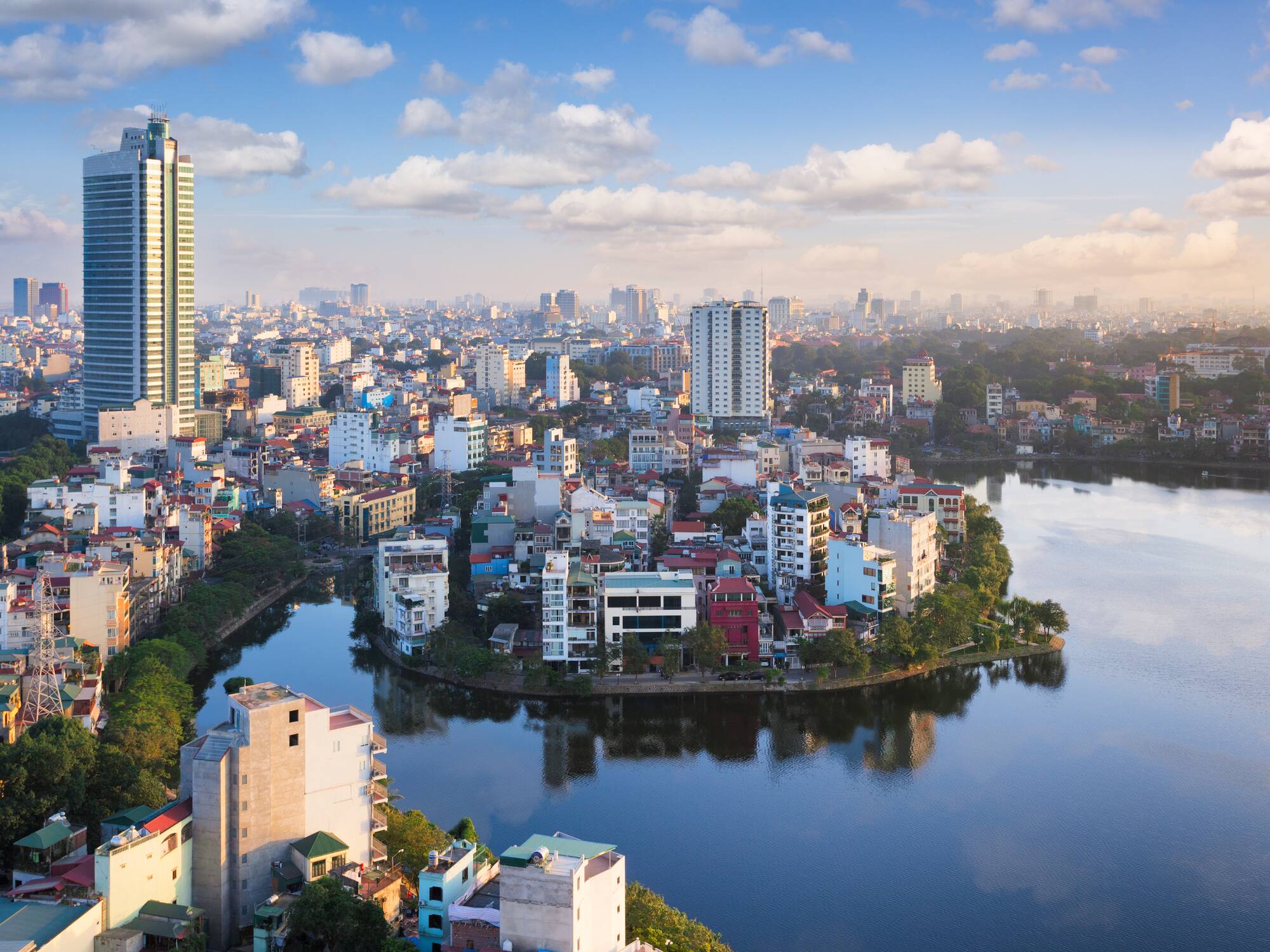 a city with buildings around a body of water