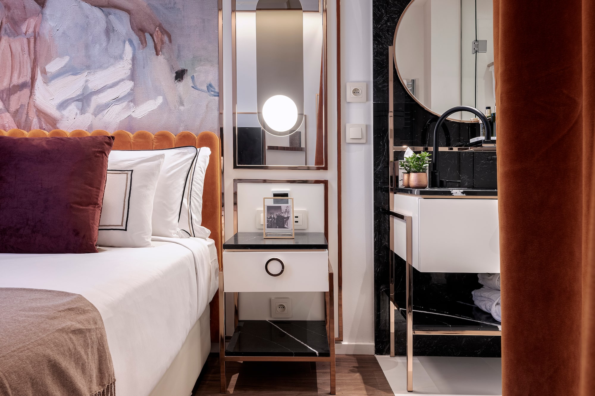 a bedroom with a mirror and a bed