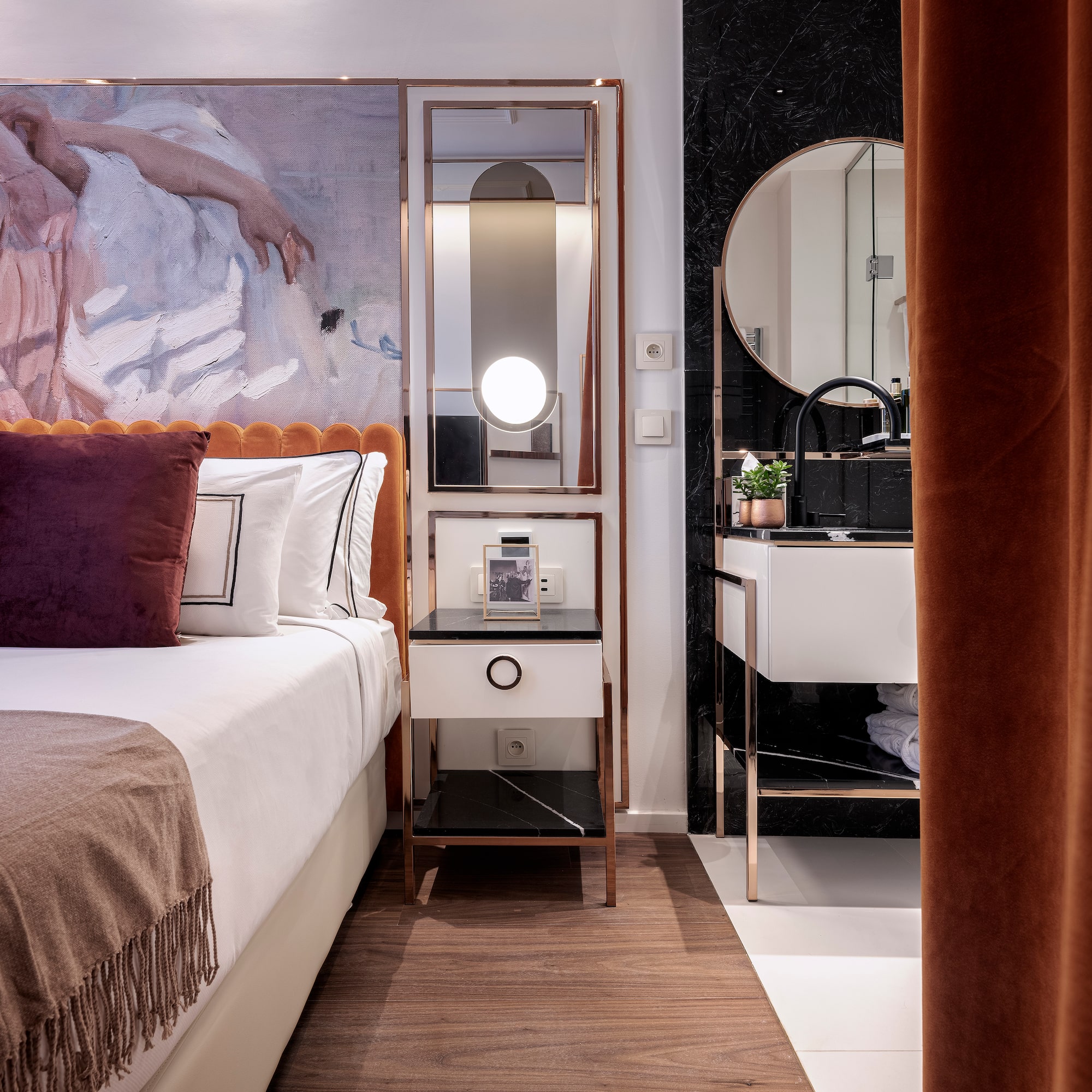 a bedroom with a mirror and a bed