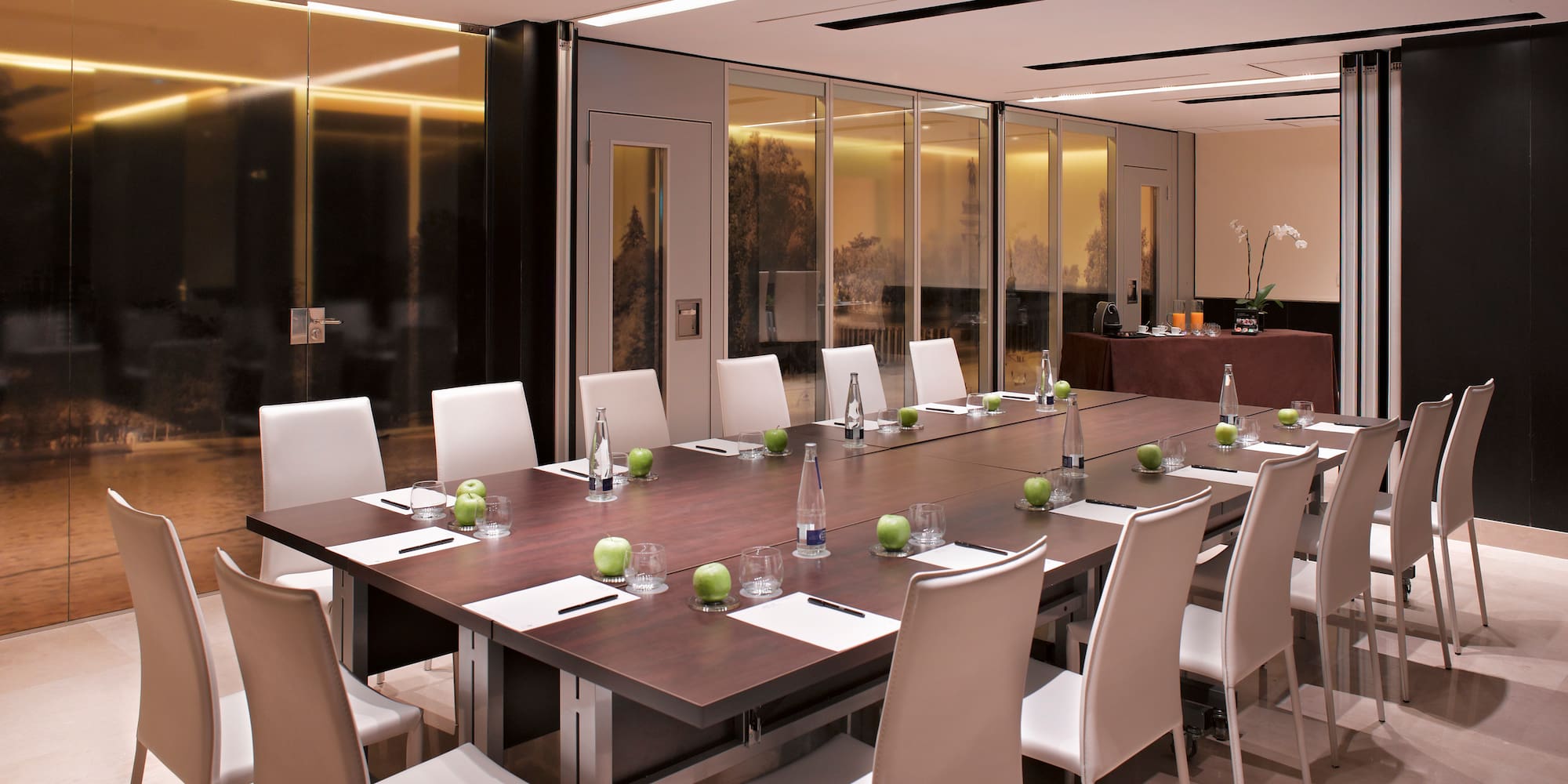 a conference room with a table and chairs