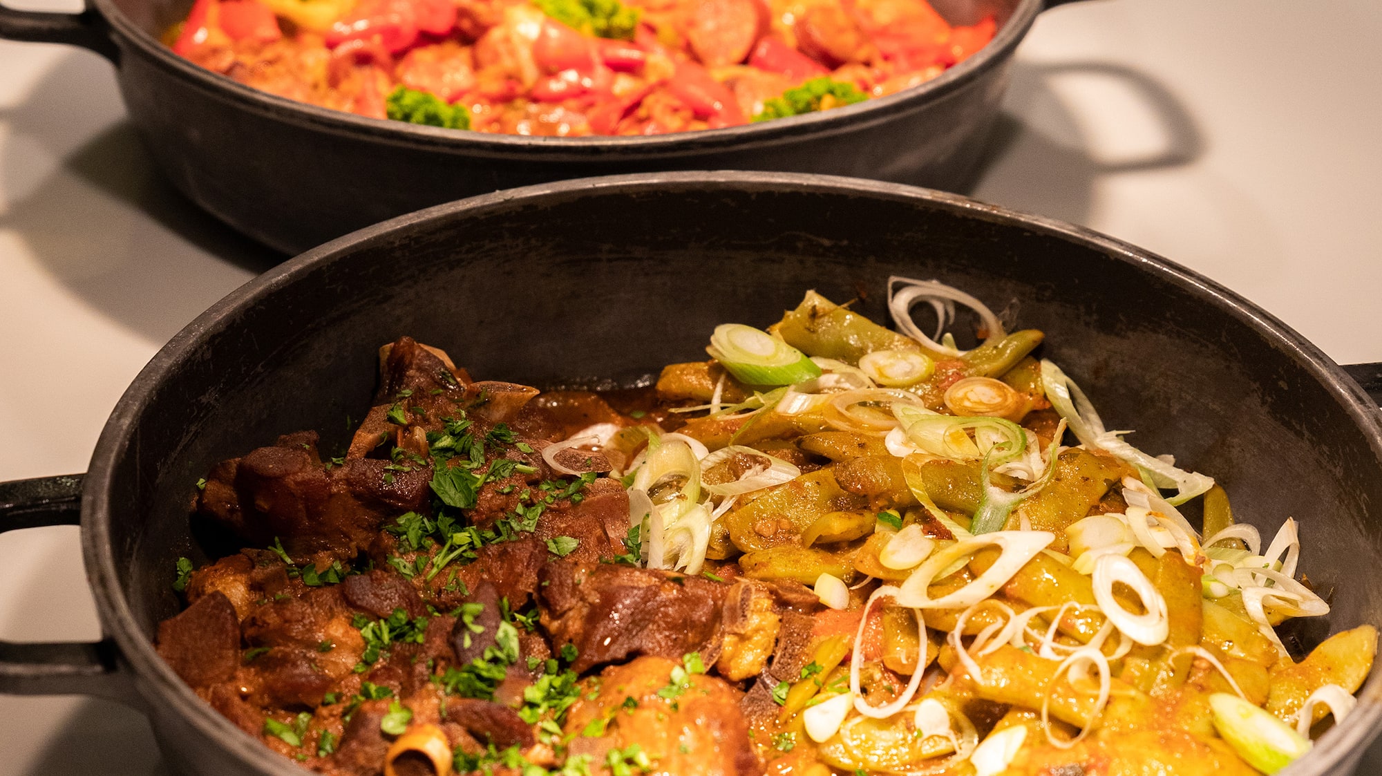 a group of pots of food