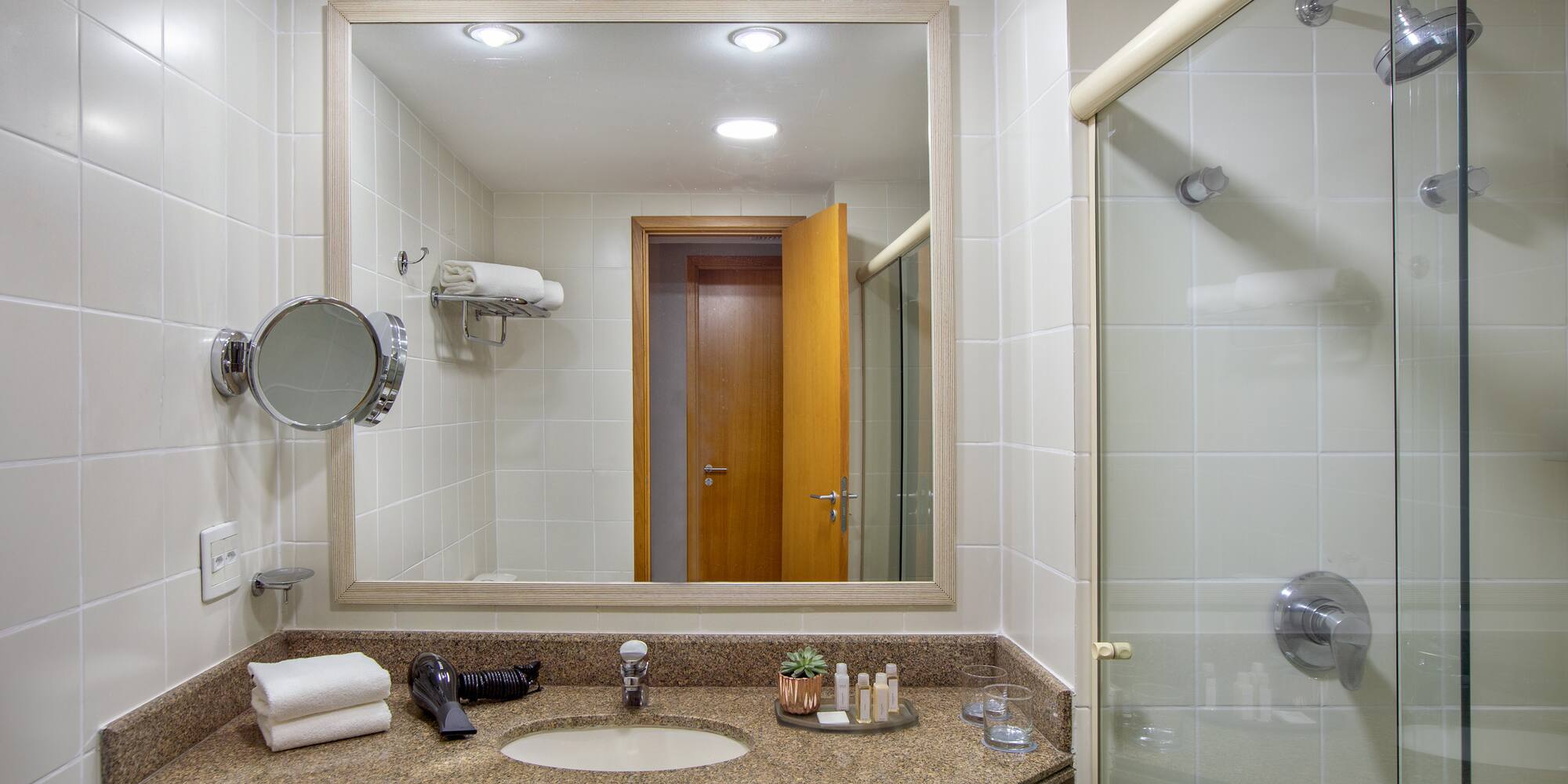 a bathroom with a mirror and a sink