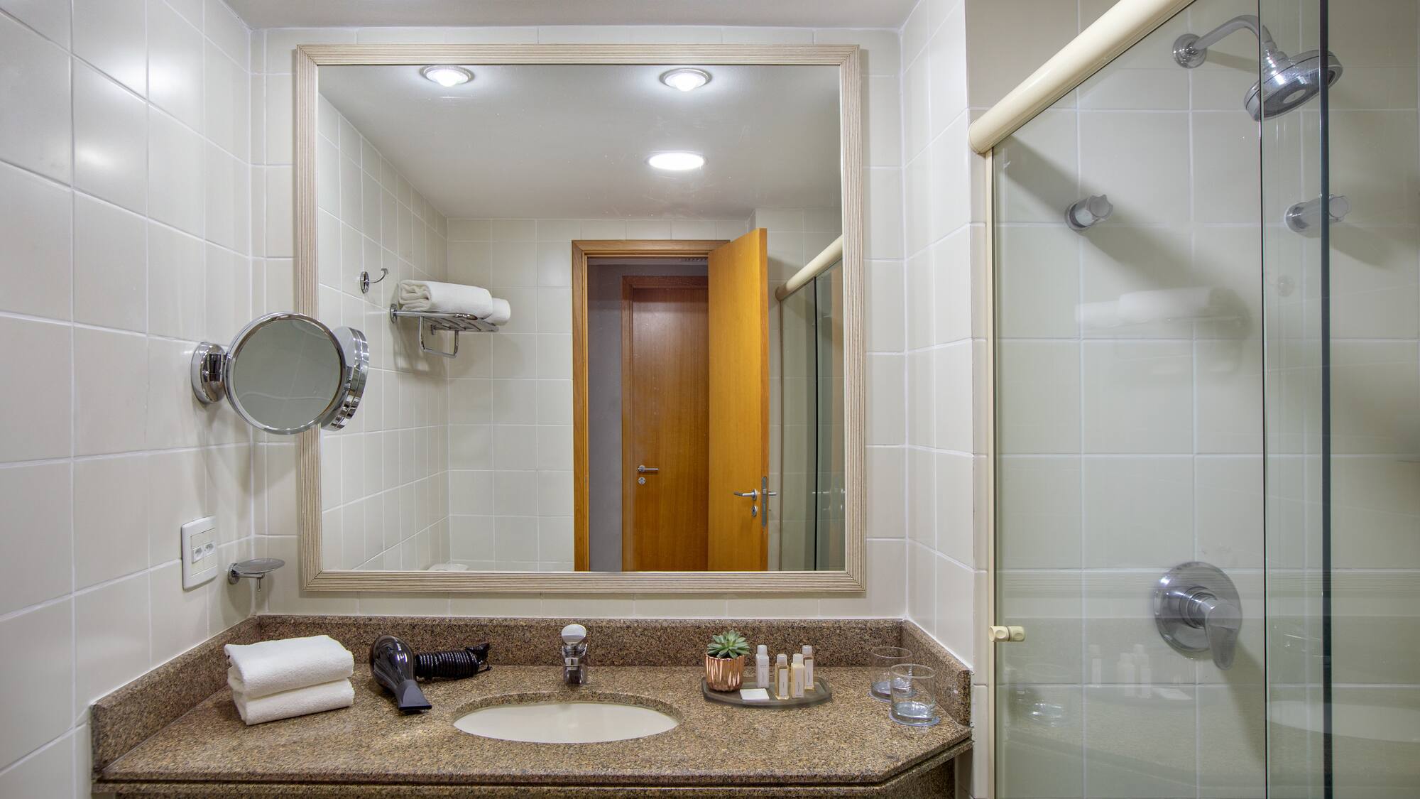 a bathroom with a mirror and a sink