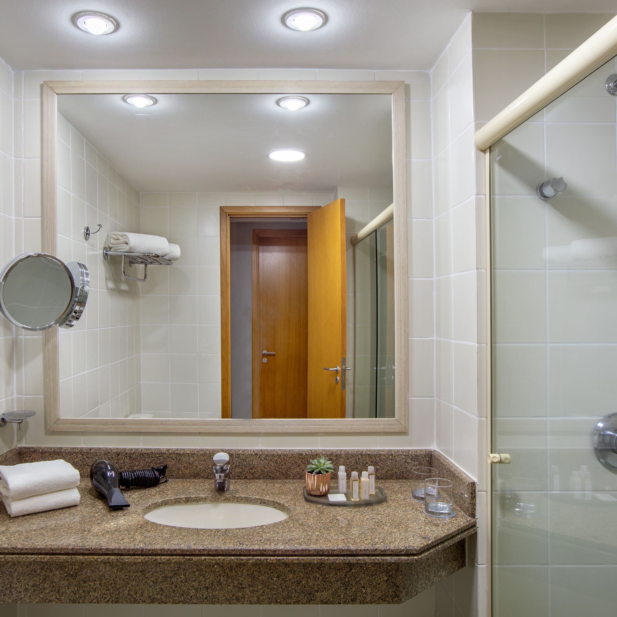 a bathroom with a mirror and a sink