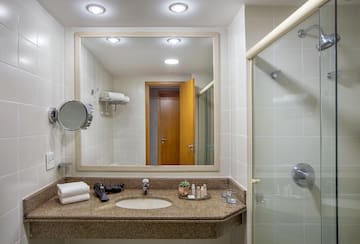 a bathroom with a mirror and a sink