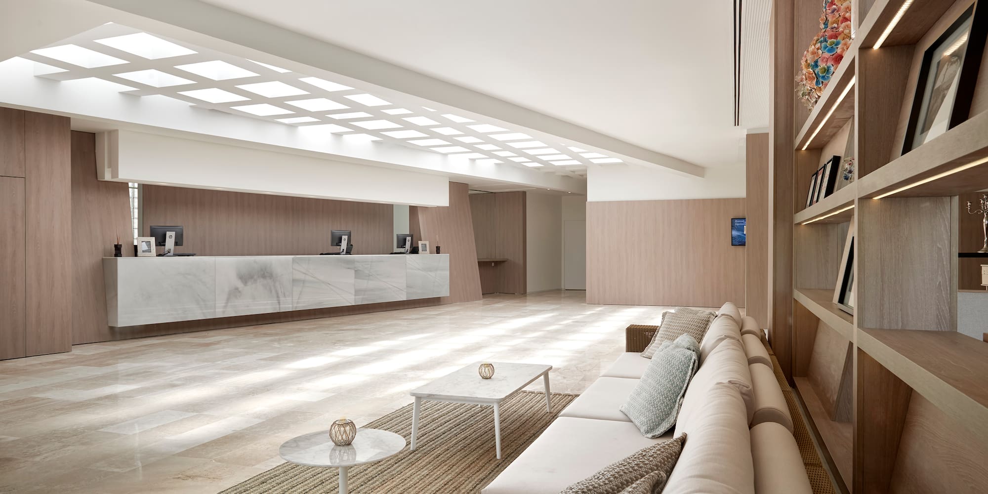 a large room with a white couch and a white table