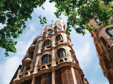 a tall building with trees in the background