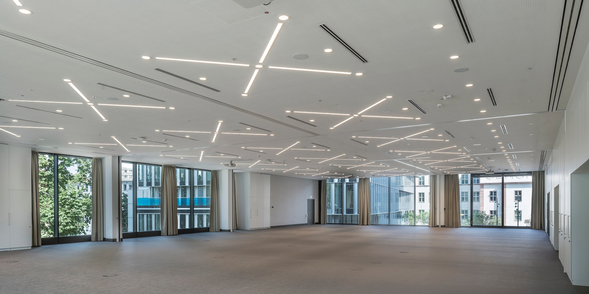 a large room with lights on the ceiling