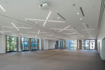 a large room with lights on the ceiling