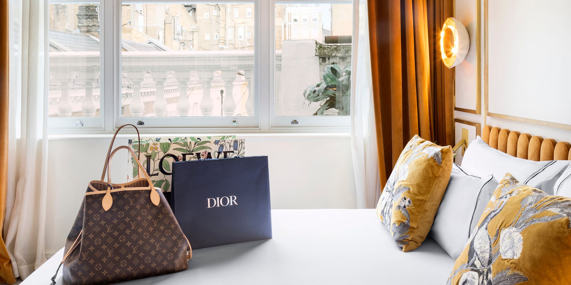 a bed with bags and a window