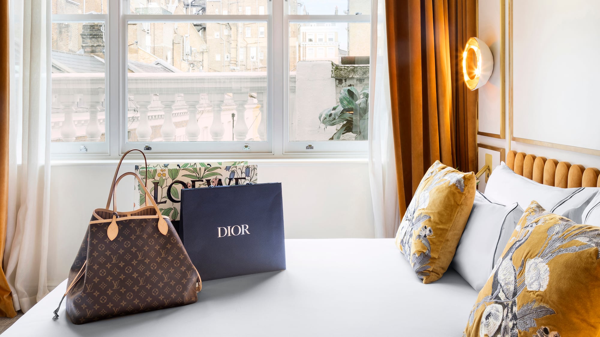 a bed with bags and a window