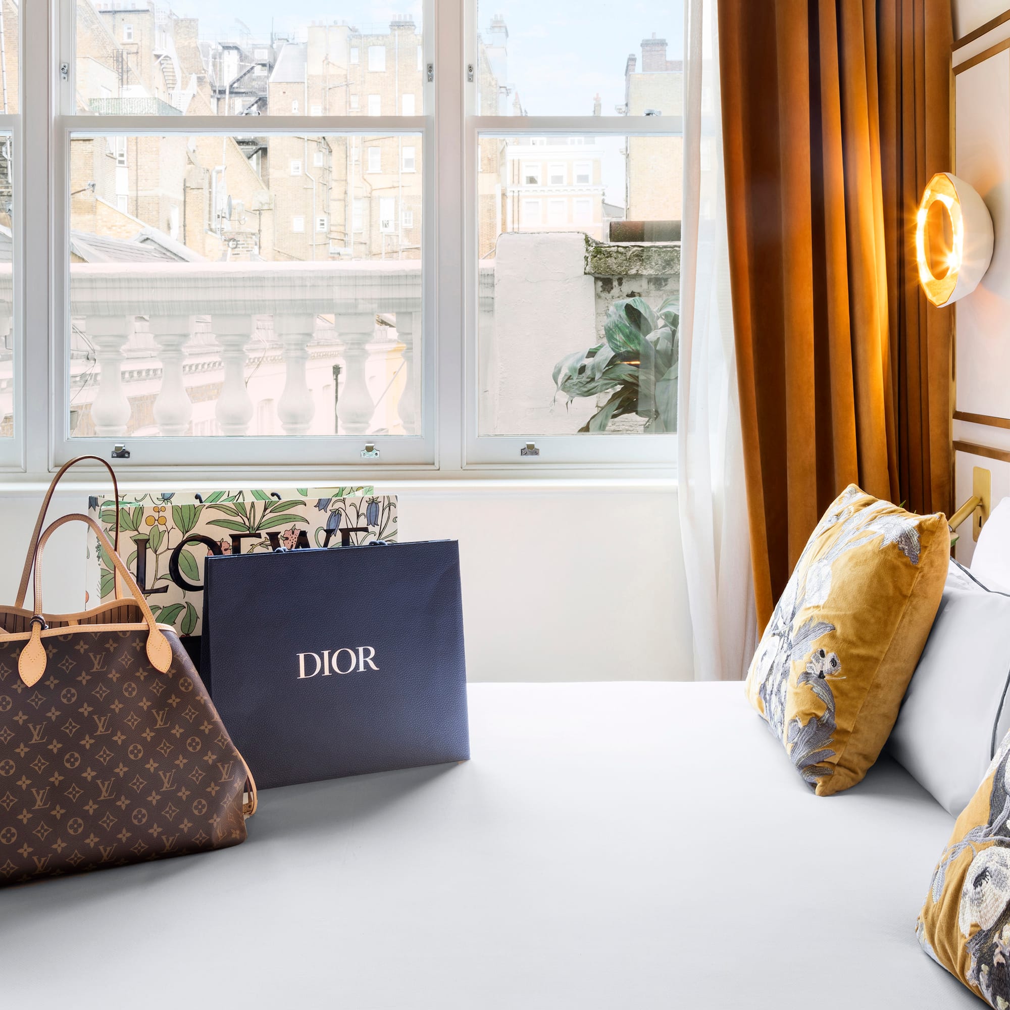 a bed with bags and a window