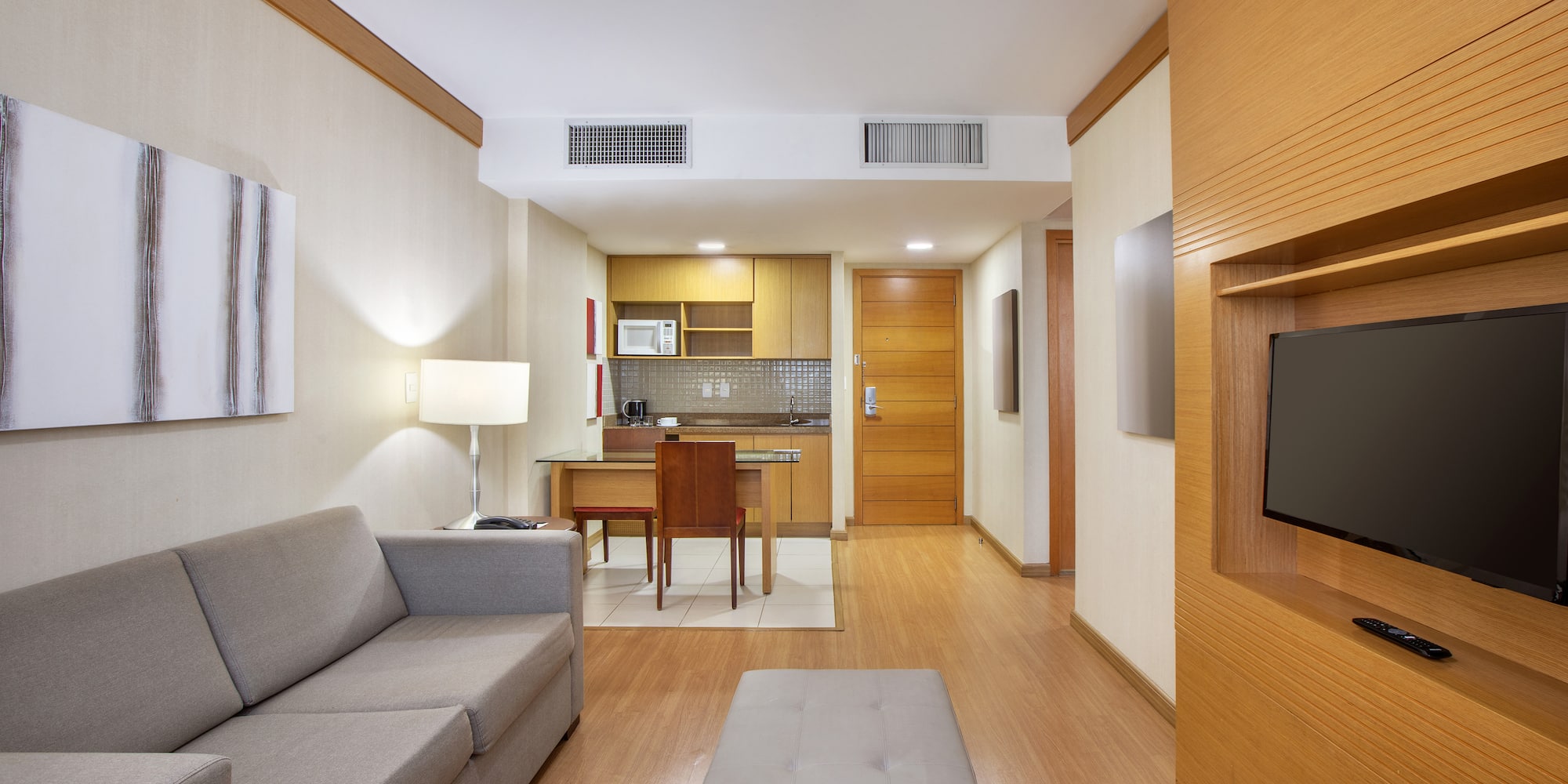 a living room with a couch and a tv