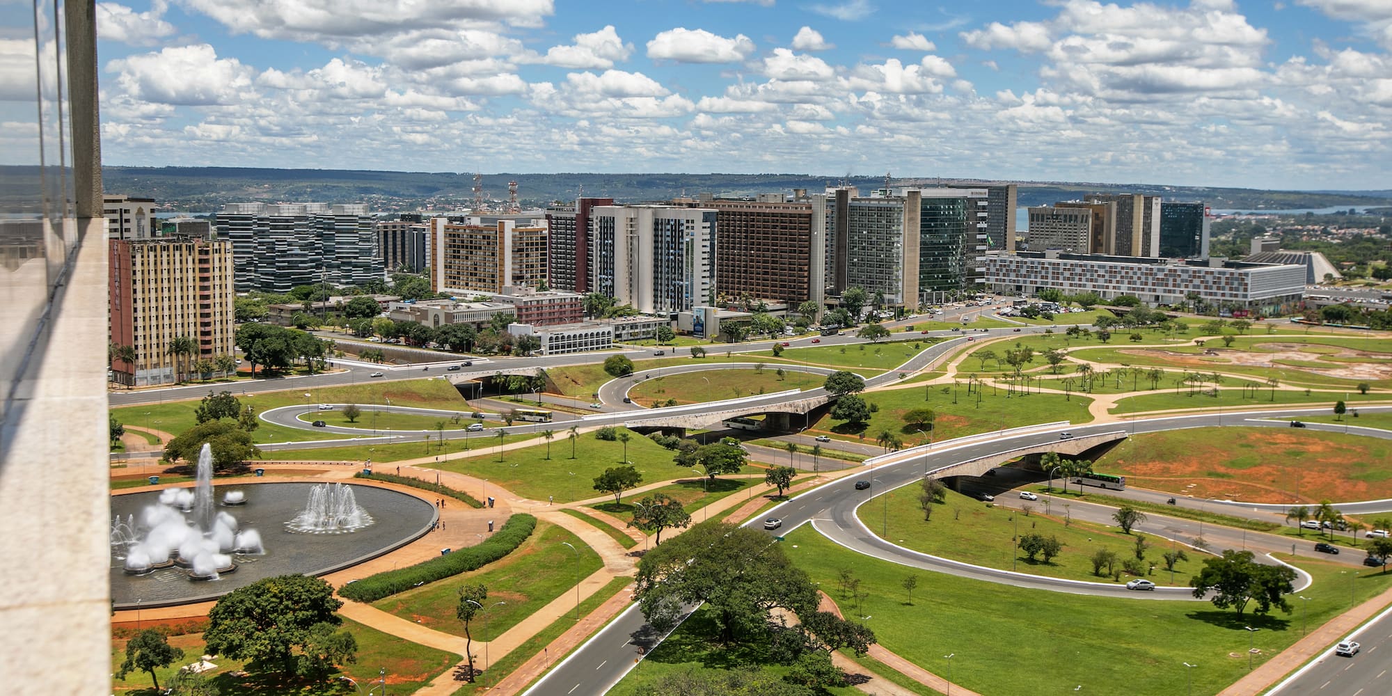 a city with a fountain and buildings