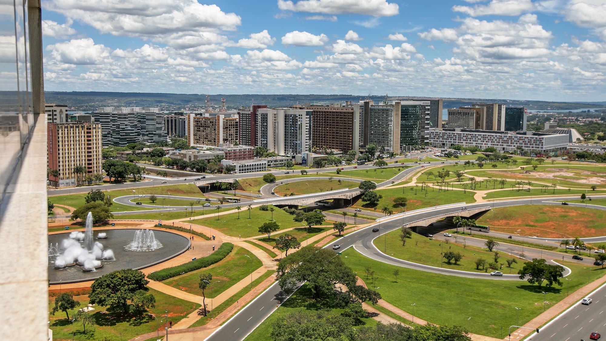 a city with a fountain and buildings