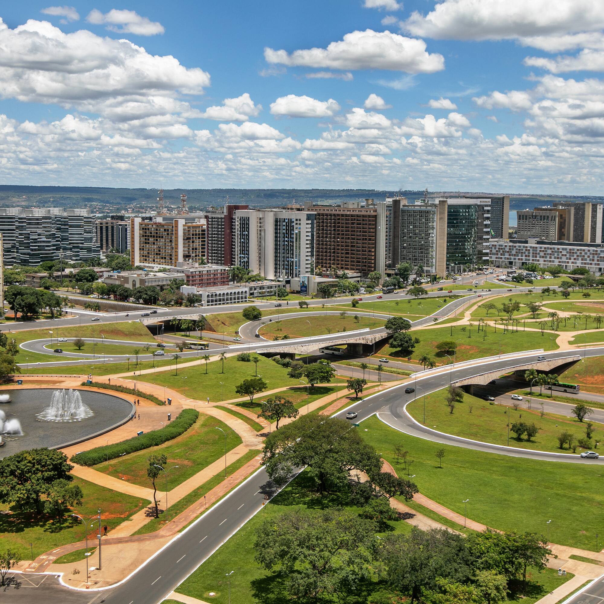 a city with a fountain and buildings