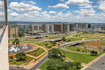a city with a fountain and buildings