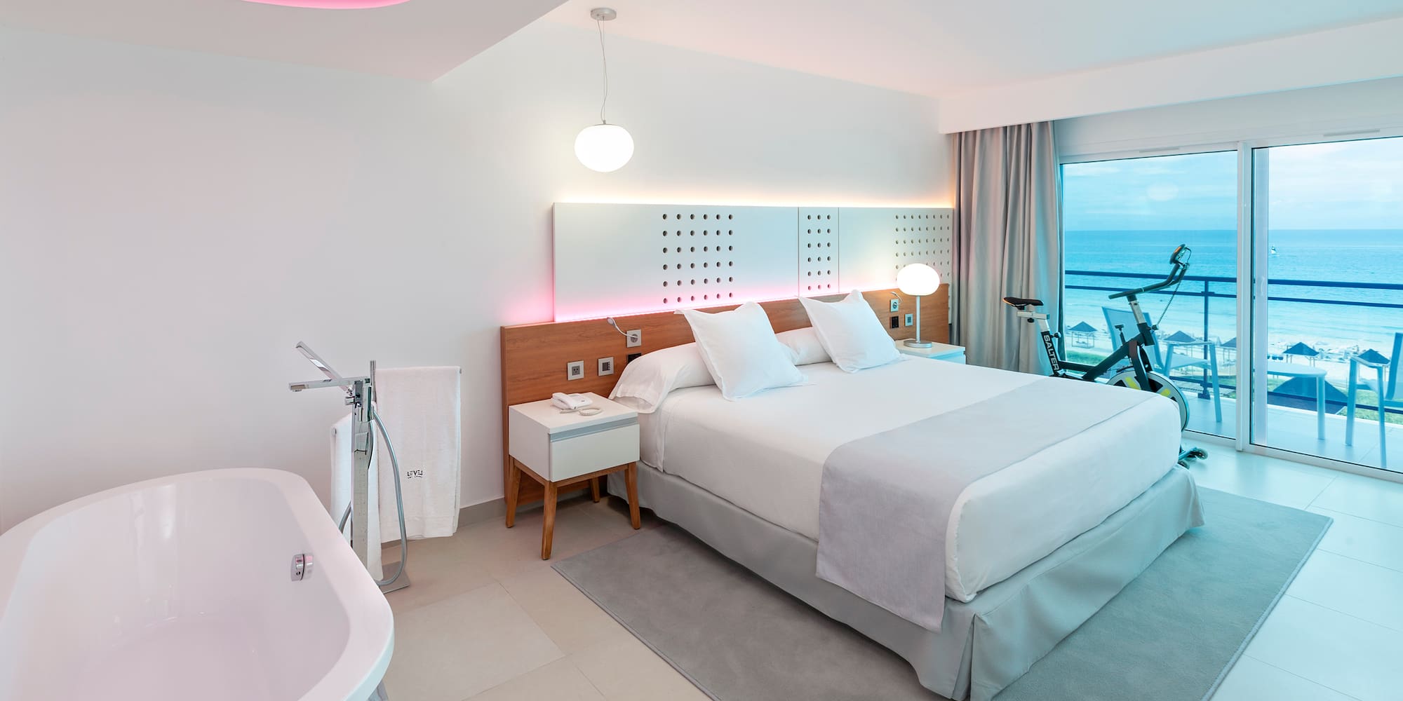 a room with a bed and tub