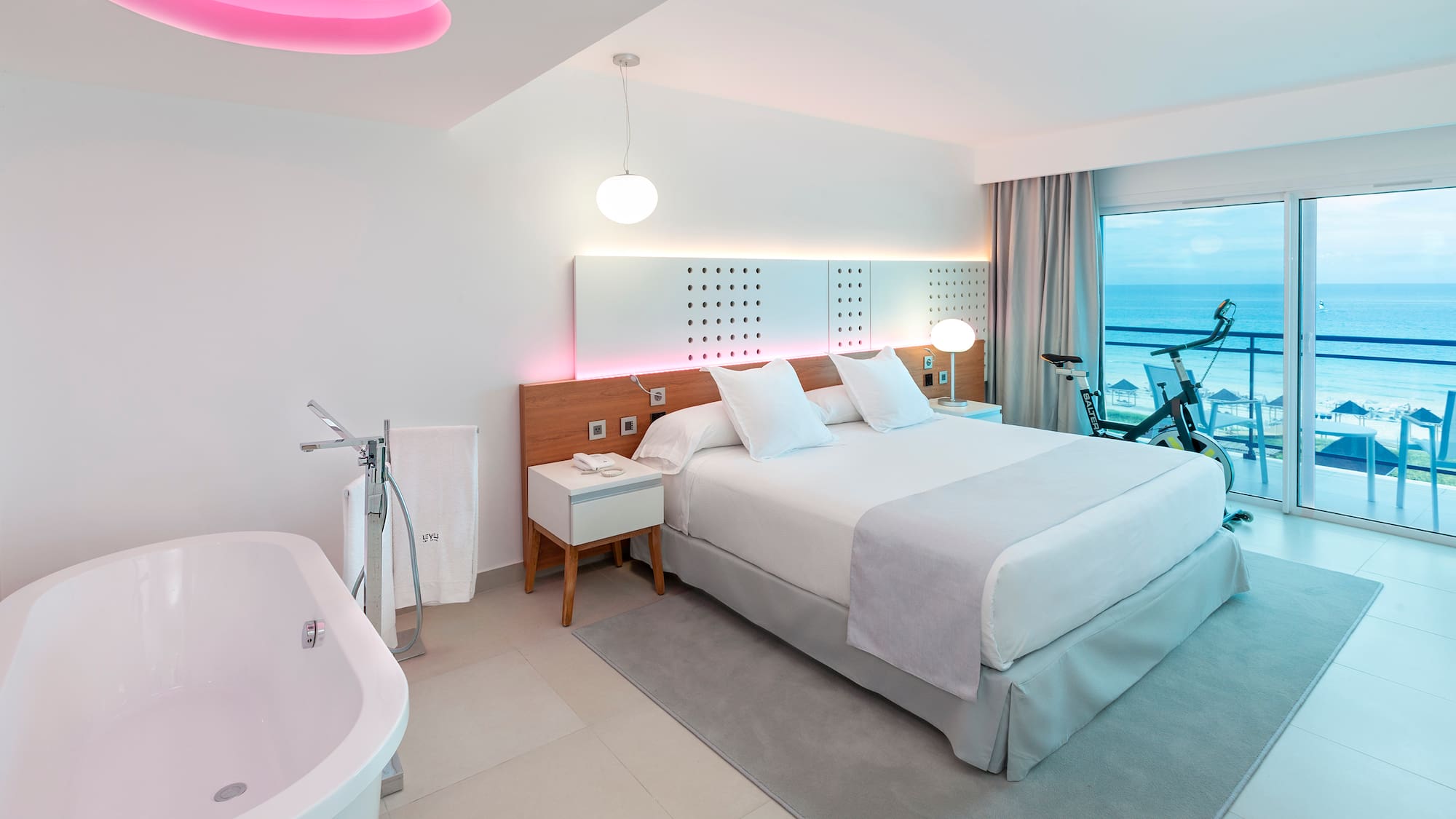 a room with a bed and tub