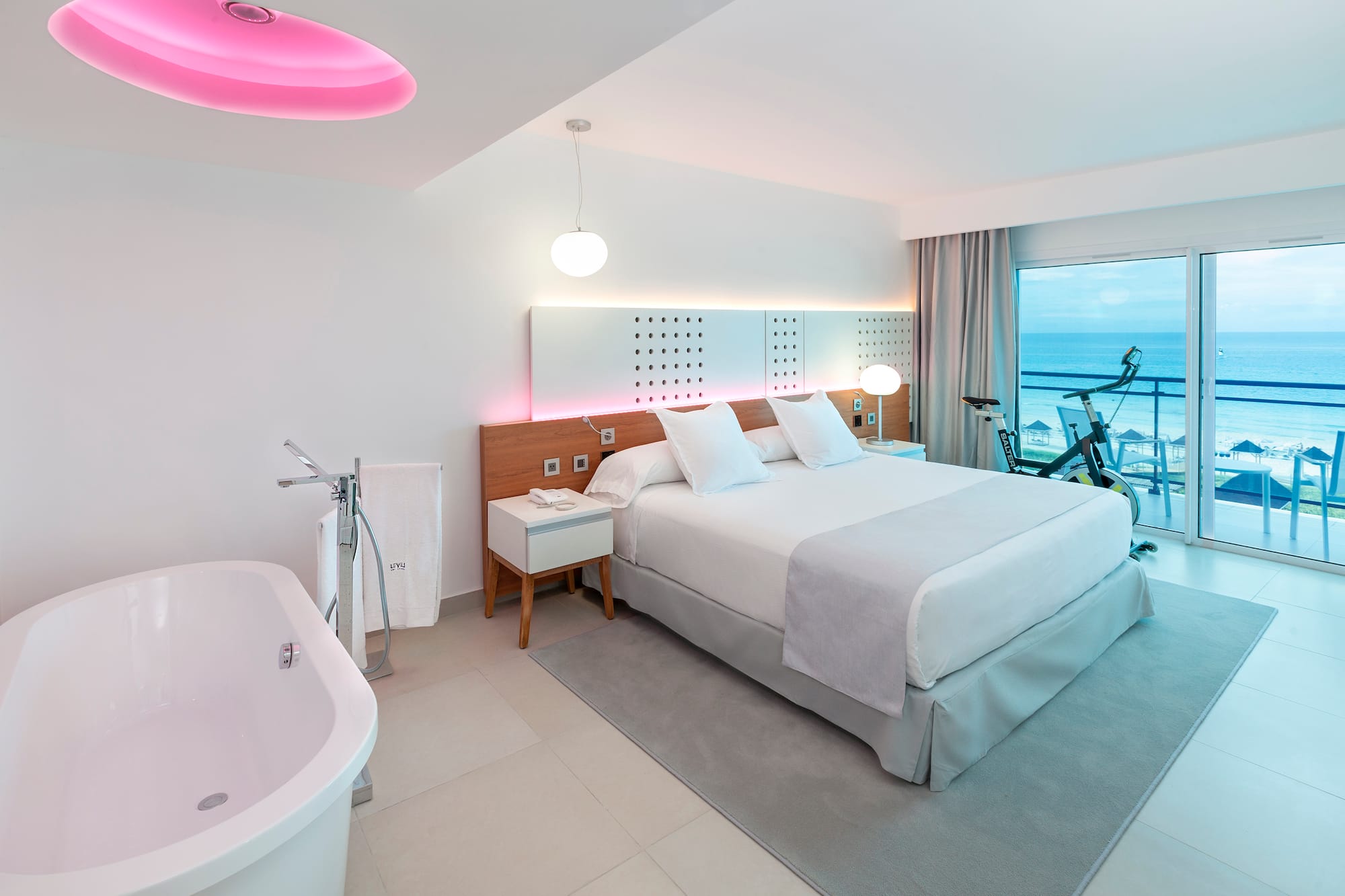 a room with a bed and tub