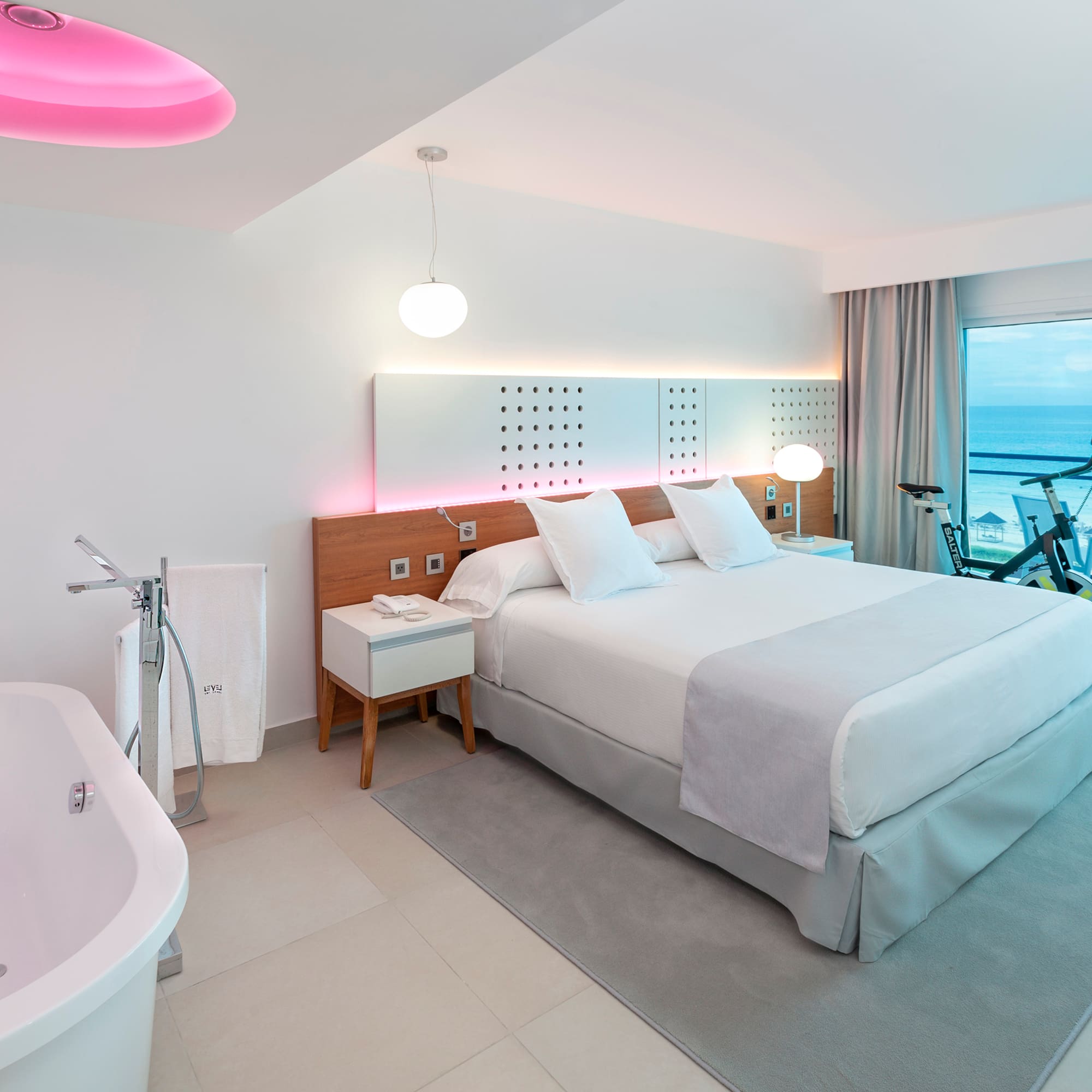 a room with a bed and tub