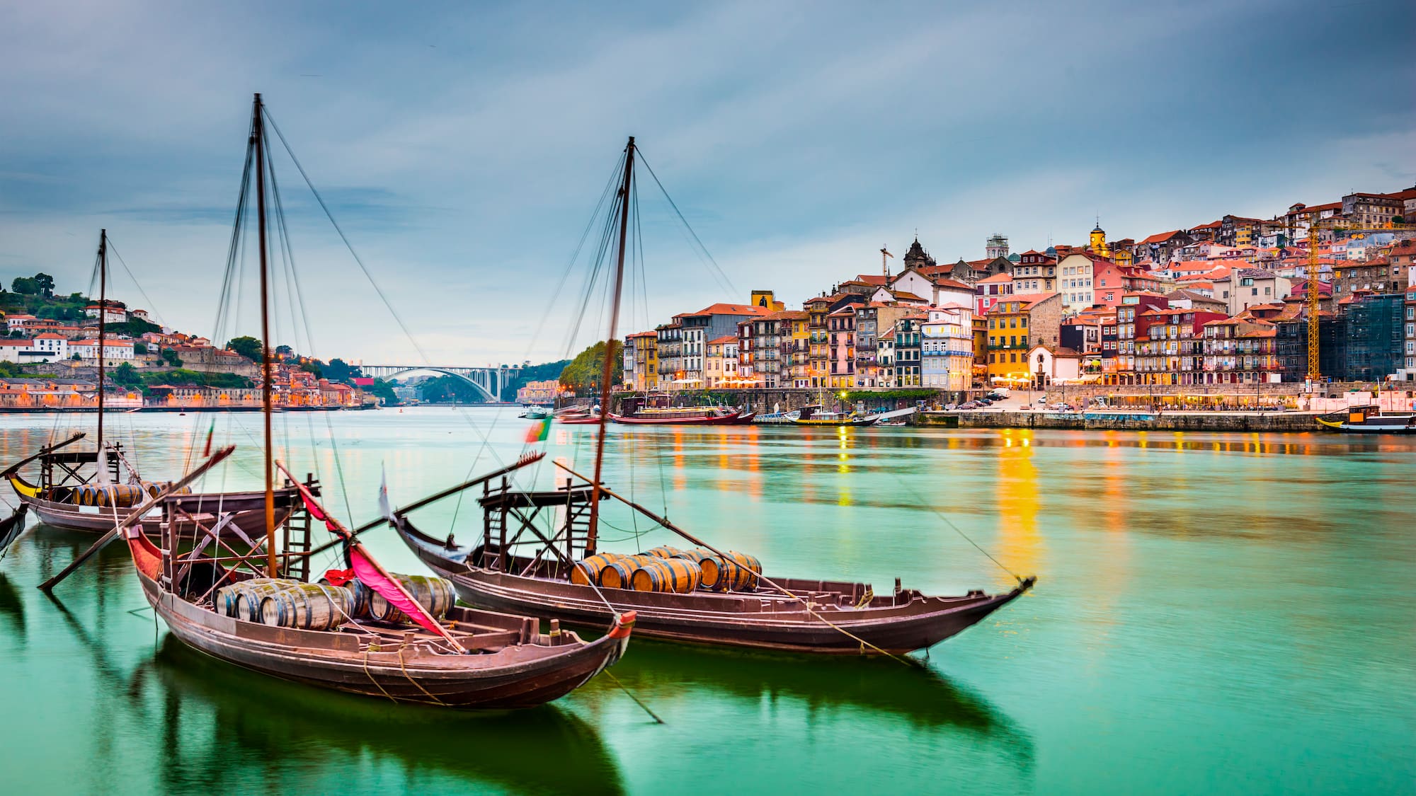 boats on the water with a city in the background