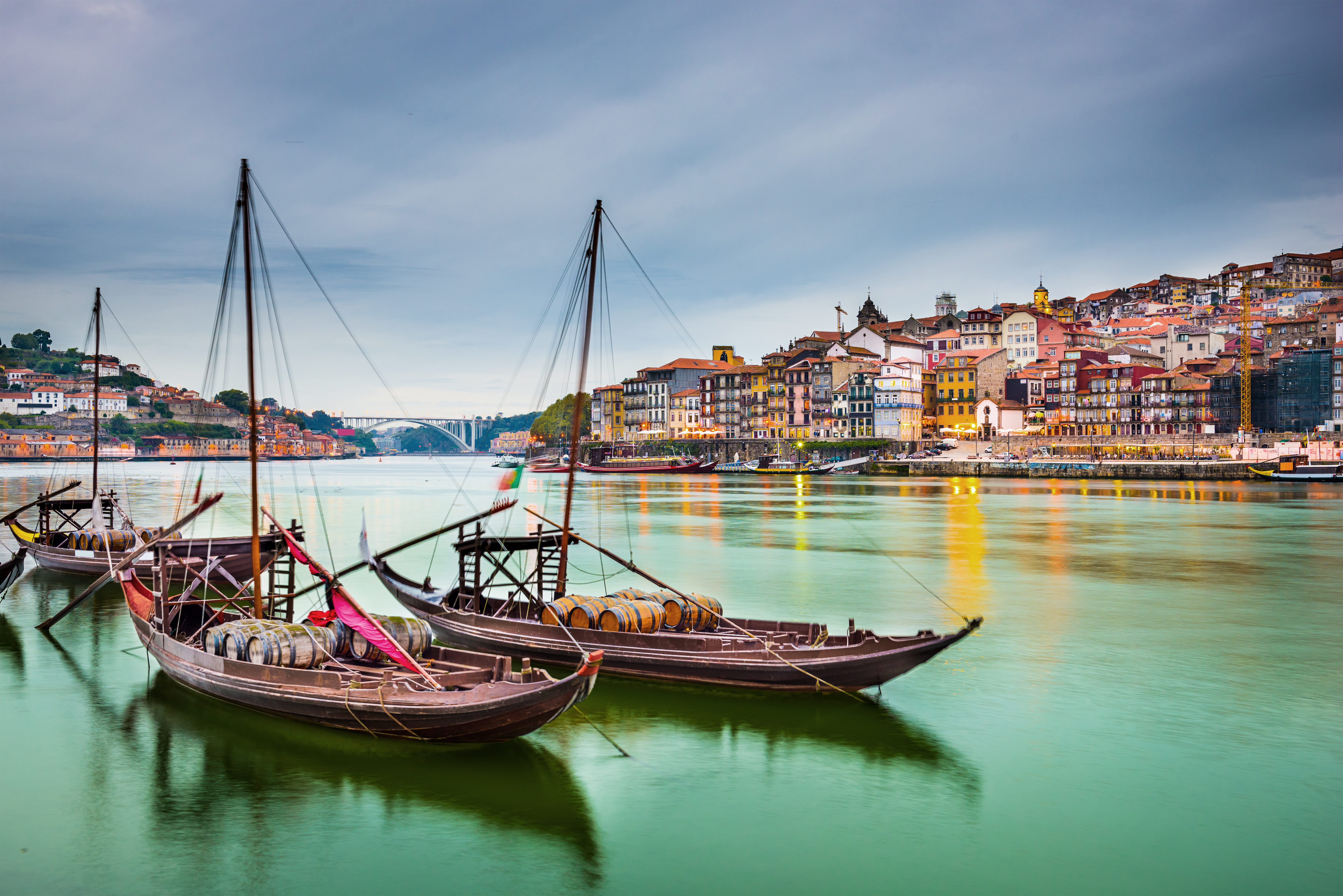 boats on the water with a city in the background