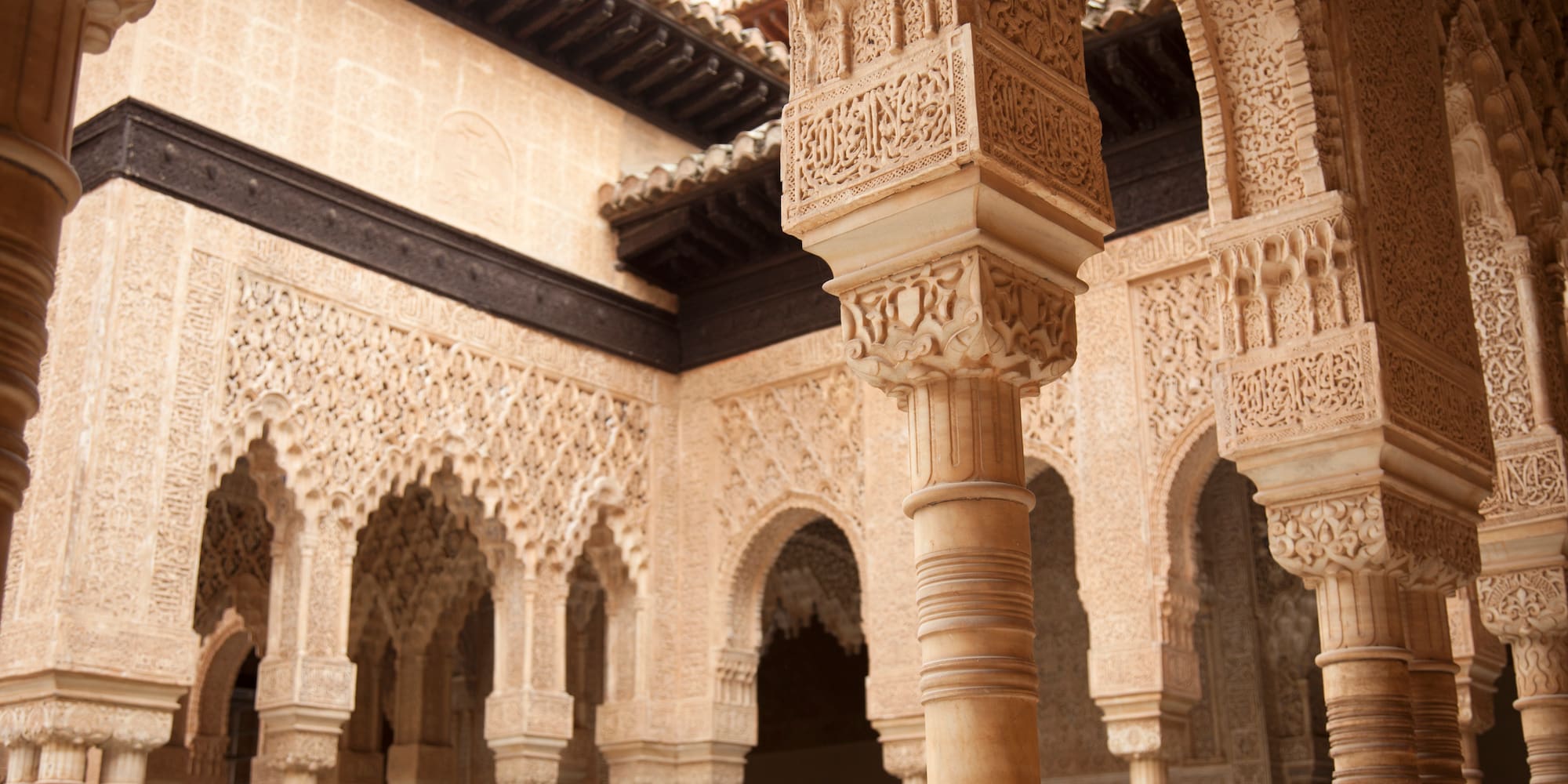 Alhambra palace: intricate carved Moorish arches and pillars.