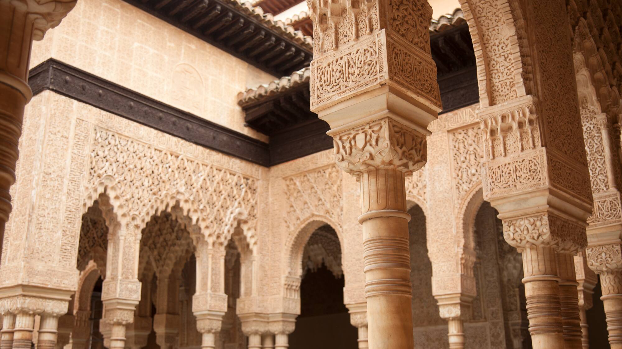 a stone building with columns and arches