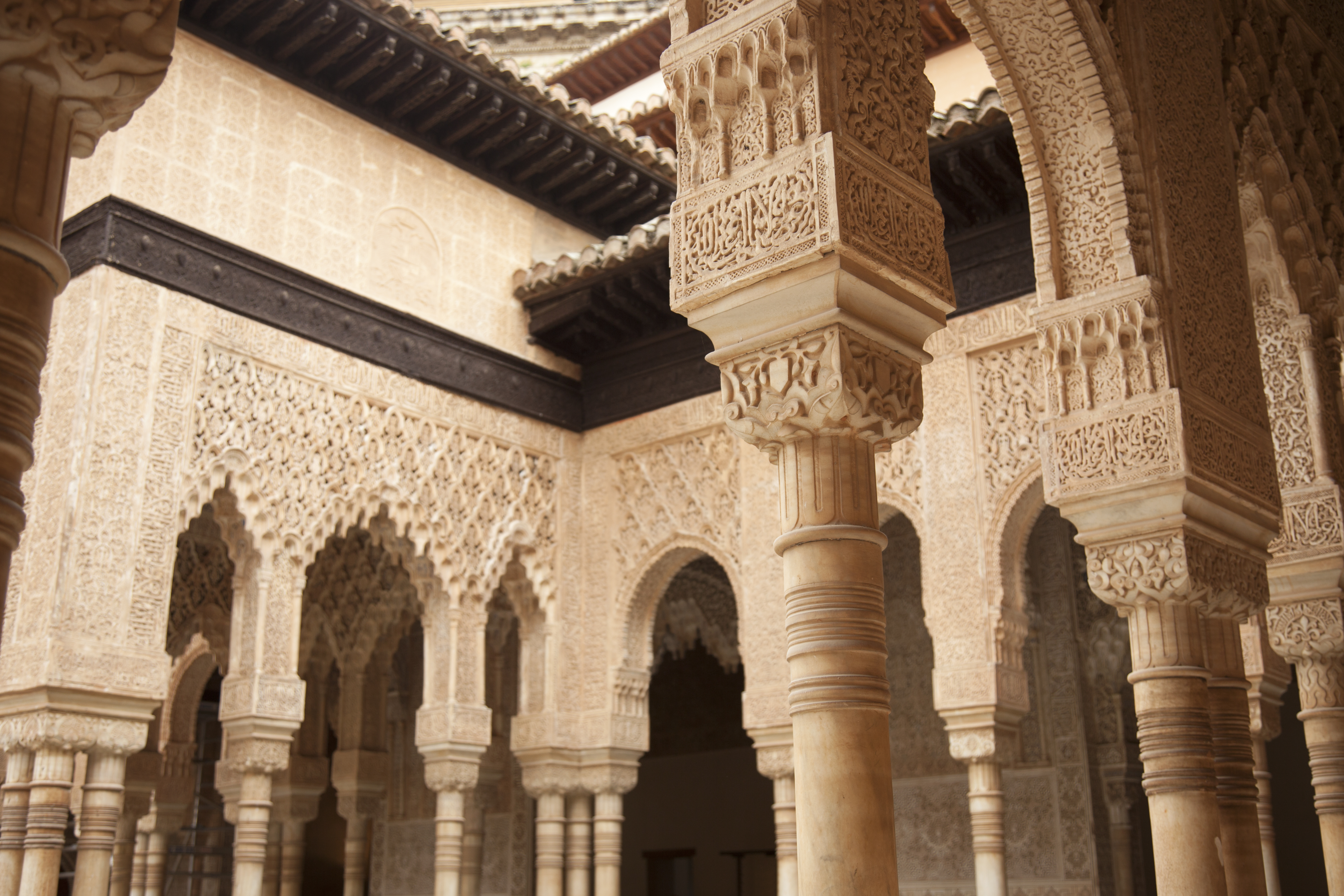 Alhambra palace: intricate carved Moorish arches and pillars.