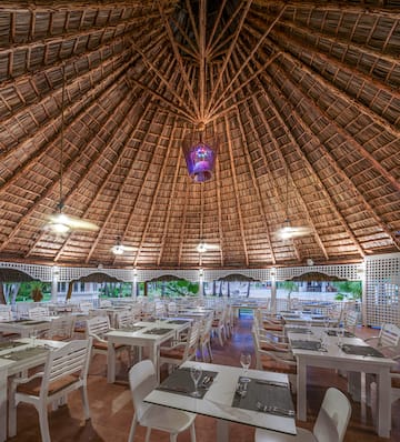 a restaurant with tables and chairs