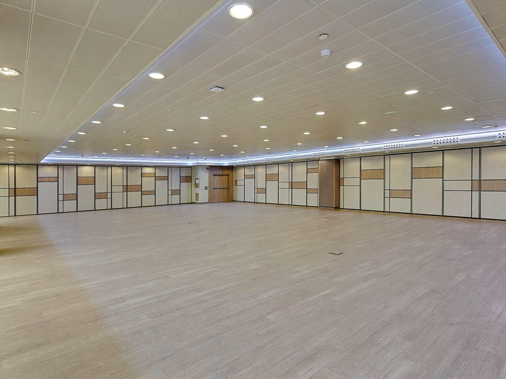 a room with doors and a wood floor